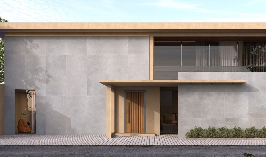 Fachada frontal de una casa contemporánea revestida con placa de gran formato